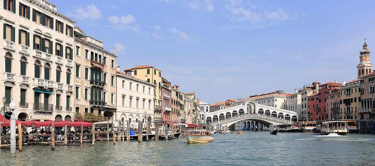 Boats and waterfront palaces along Venice's Grand Canal near Rialto