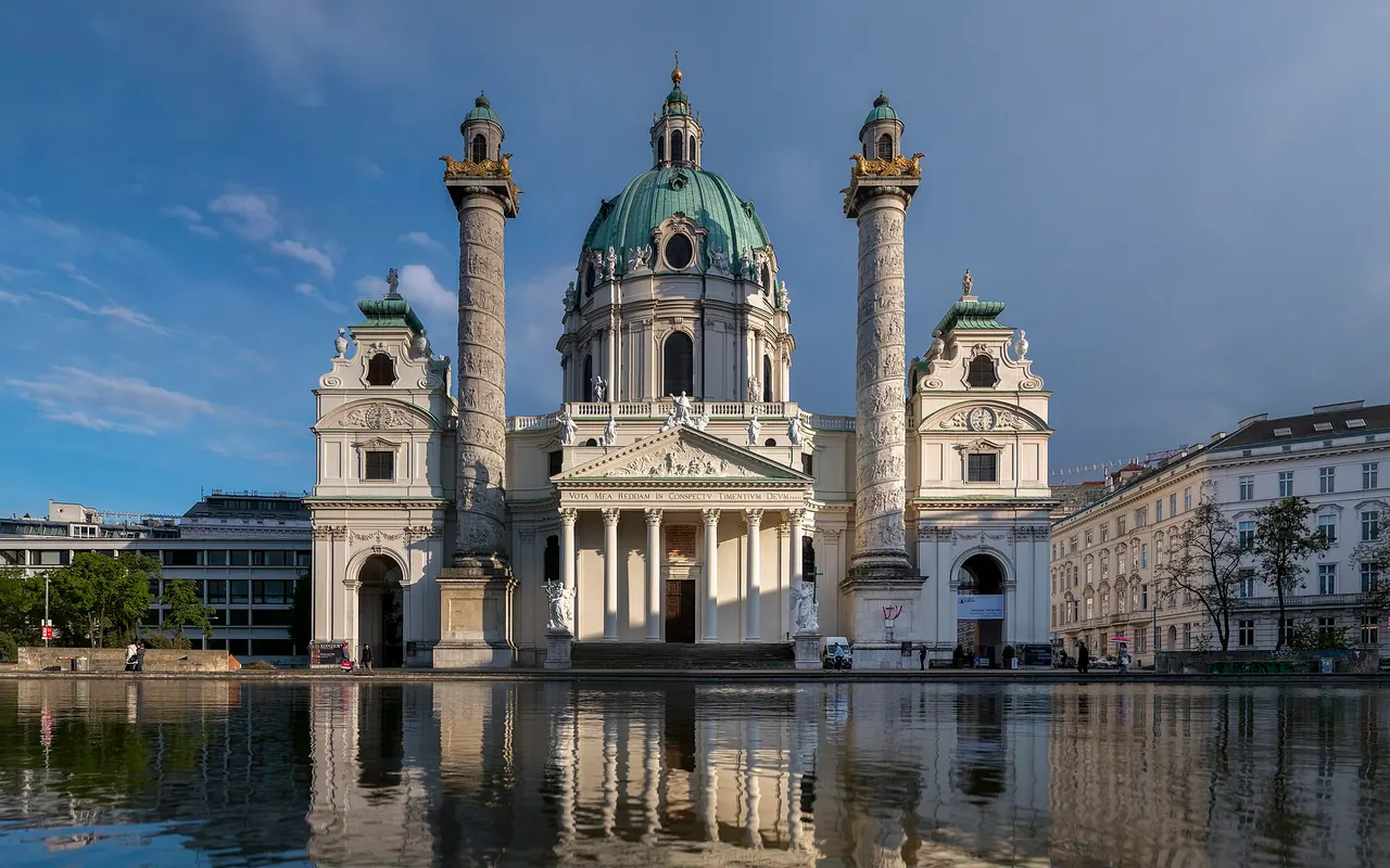 Karlskirche's green dome and paired monumental columns overlooking its forecourt