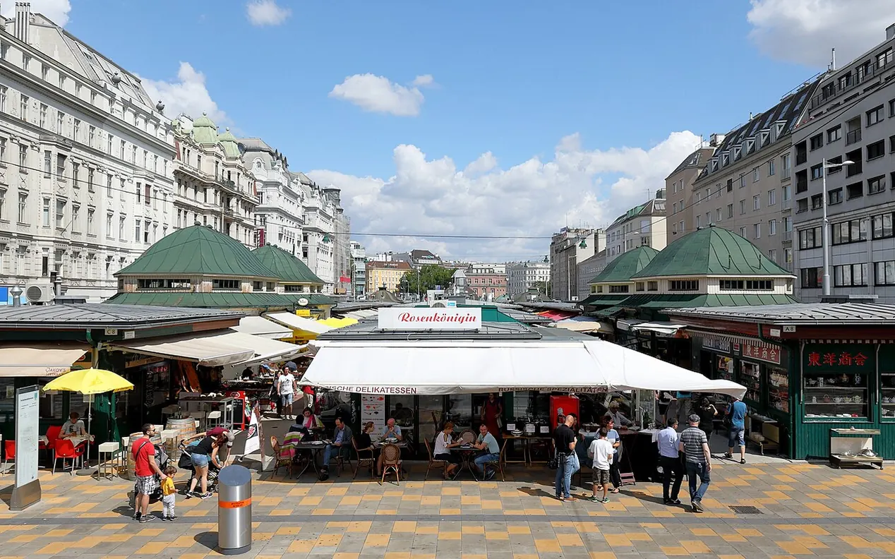 Food stalls and shoppers along Vienna's Naschmarkt