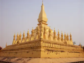 The golden stupa and smaller spires of Pha That Luang