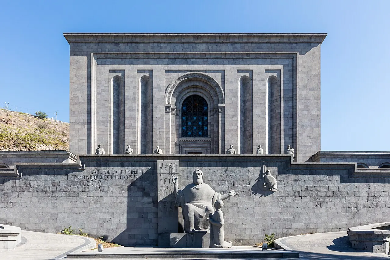 The Matenadaran entrance with carved stone figures and a central arch